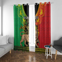 Window curtains with green and red Lion of Judah prints, gold trim, black heading clips.