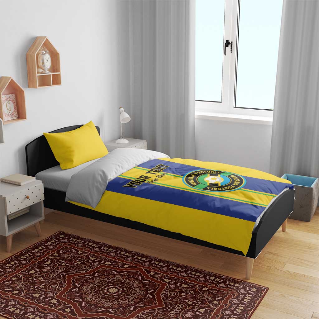 Yellow and blue Tanzania football bedding set with custom text and football crest on duvet