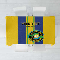 Yellow and blue sports tablecloth with green stripe and circular team emblem design