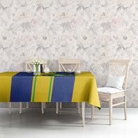 Yellow and blue striped tablecloth with green lines and circular soccer emblem print