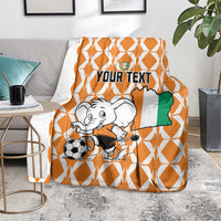 Orange and white elephant football blanket draped over chair