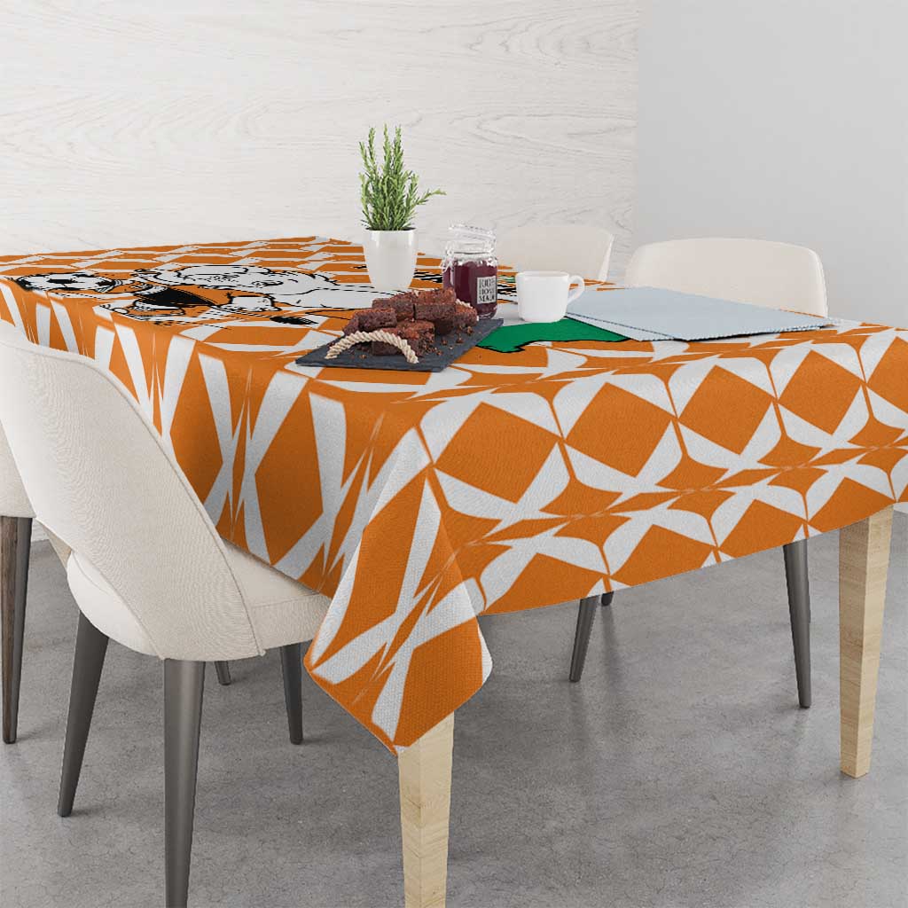 Orange patterned football tablecloth with diamond shapes on a dining table