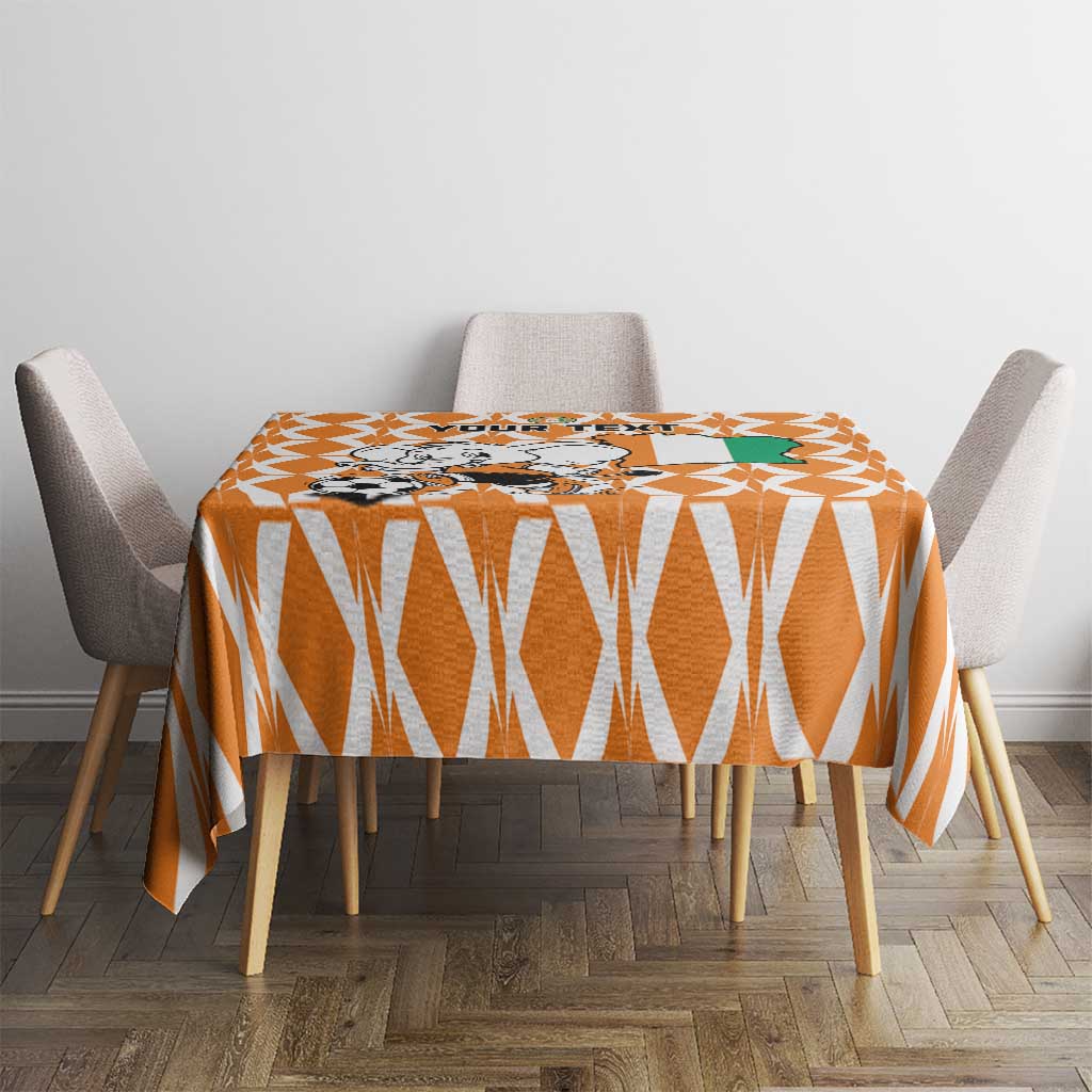 Orange geometric football tablecloth on a round table with four chairs