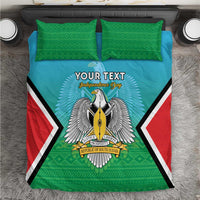 Personalised bedding set close-up: teal duvet with green trim, coat-of-arms and red/white side panels