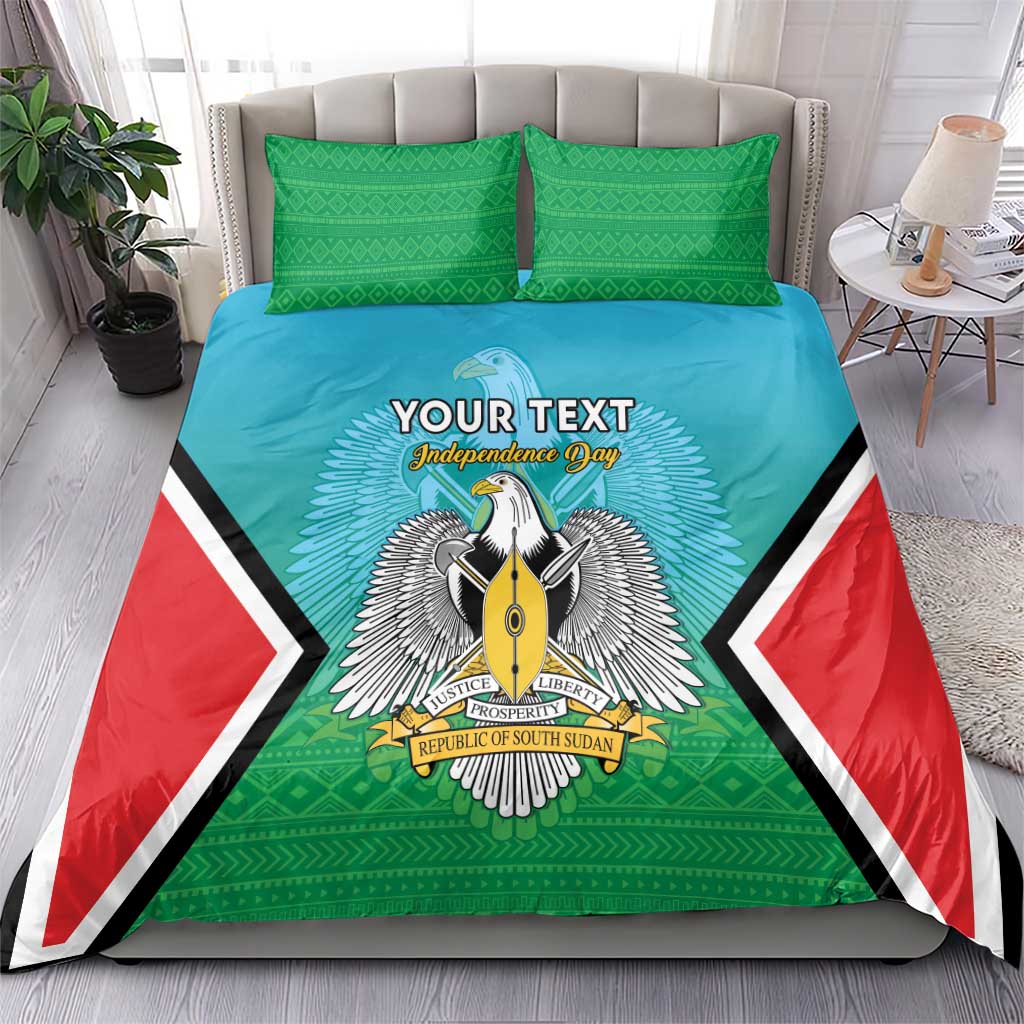 Personalised bedding set on a bed with teal duvet, green pillowcases, bold coat-of-arms center