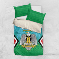 Personalised bedding set with teal duvet and green patterned pillowcases, coat-of-arms graphic