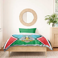 Personalised bedding set with teal duvet and green pillowcase pair, coat-of-arms and flag design