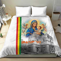 White duvet cover and pillowcases with Mary and baby print plus Ethiopian flag stripe