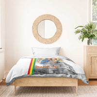 White duvet cover over a bed with Mary and baby church artwork and Ethiopian flag stripe