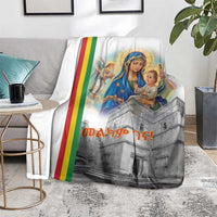 Christmas blanket on carpet, Saint Mary and angels with rainbow stripe and gray church scene