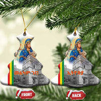 Pair of white ceramic bell-shaped ornaments with Saint Mary and church artwork, gold loops