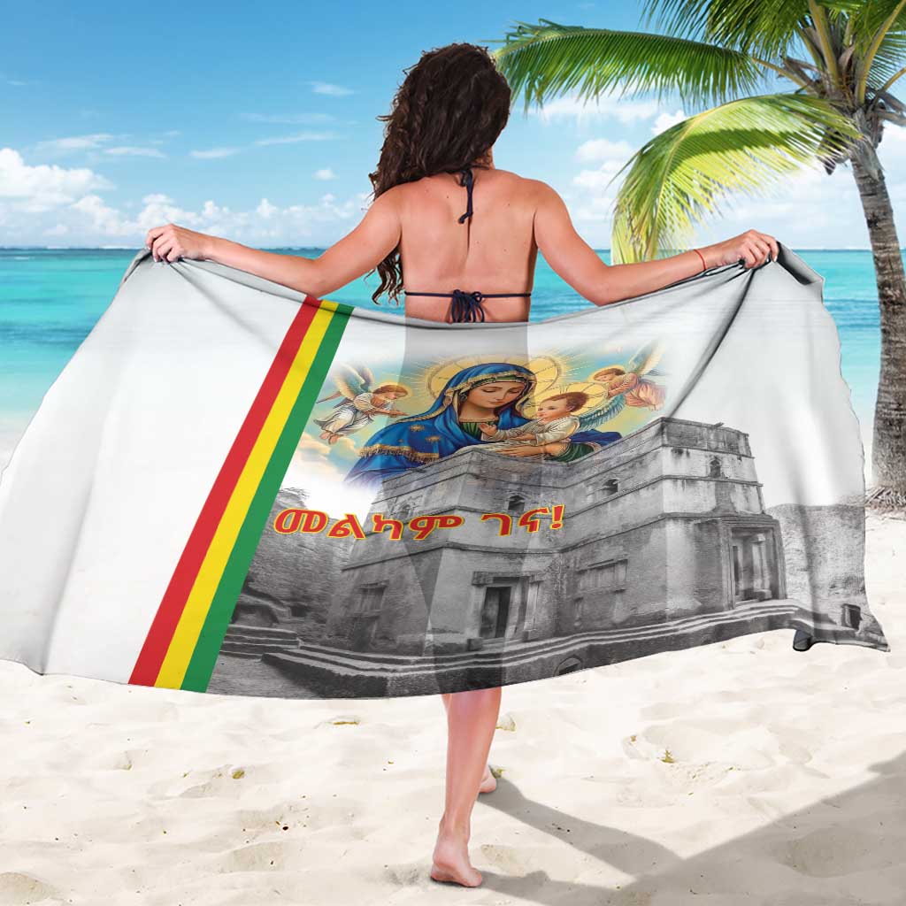 White sarong with Madonna and child over gray church print, worn from behind
