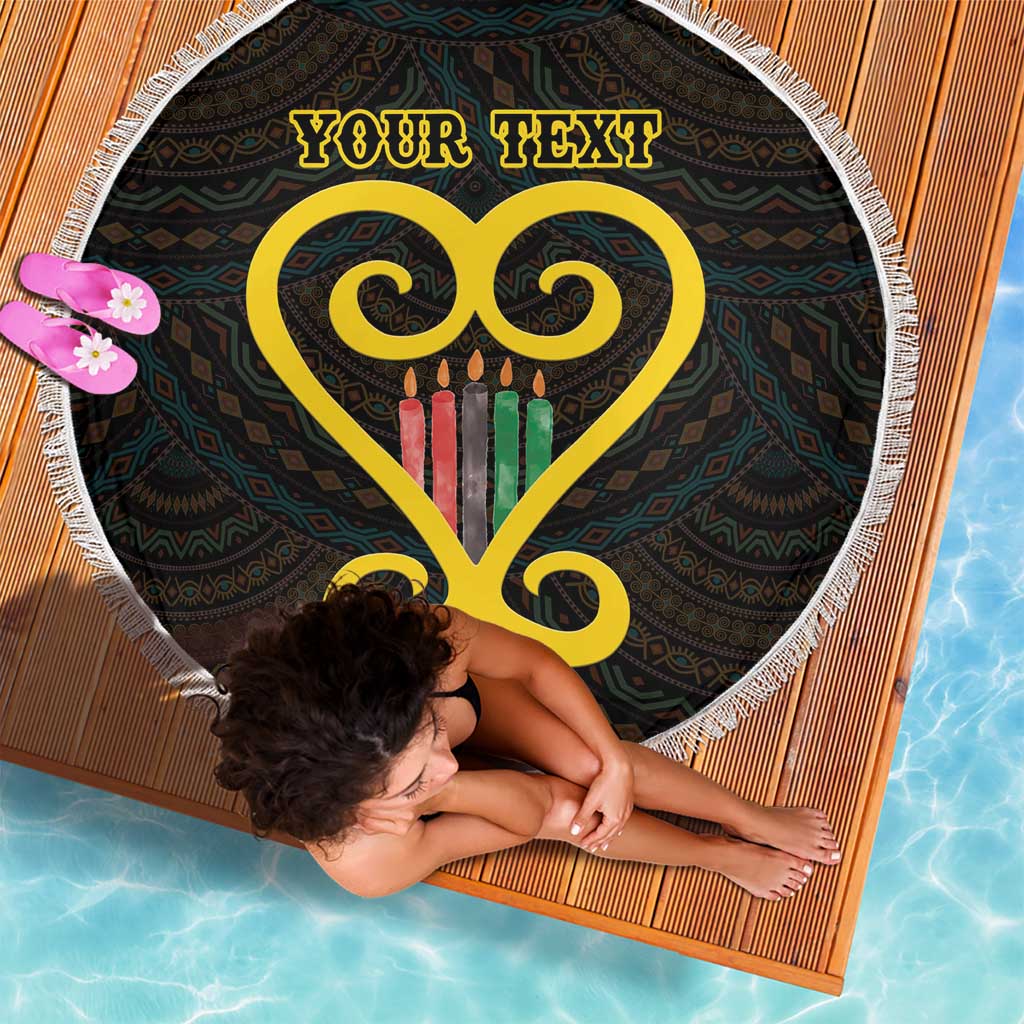 Corner view round black beach blanket with white fringe, yellow heart and Adinkra, 'Your Text'