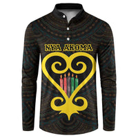 Dark hooded button sweatshirt with teal pattern, gold text, and candle-heart emblem