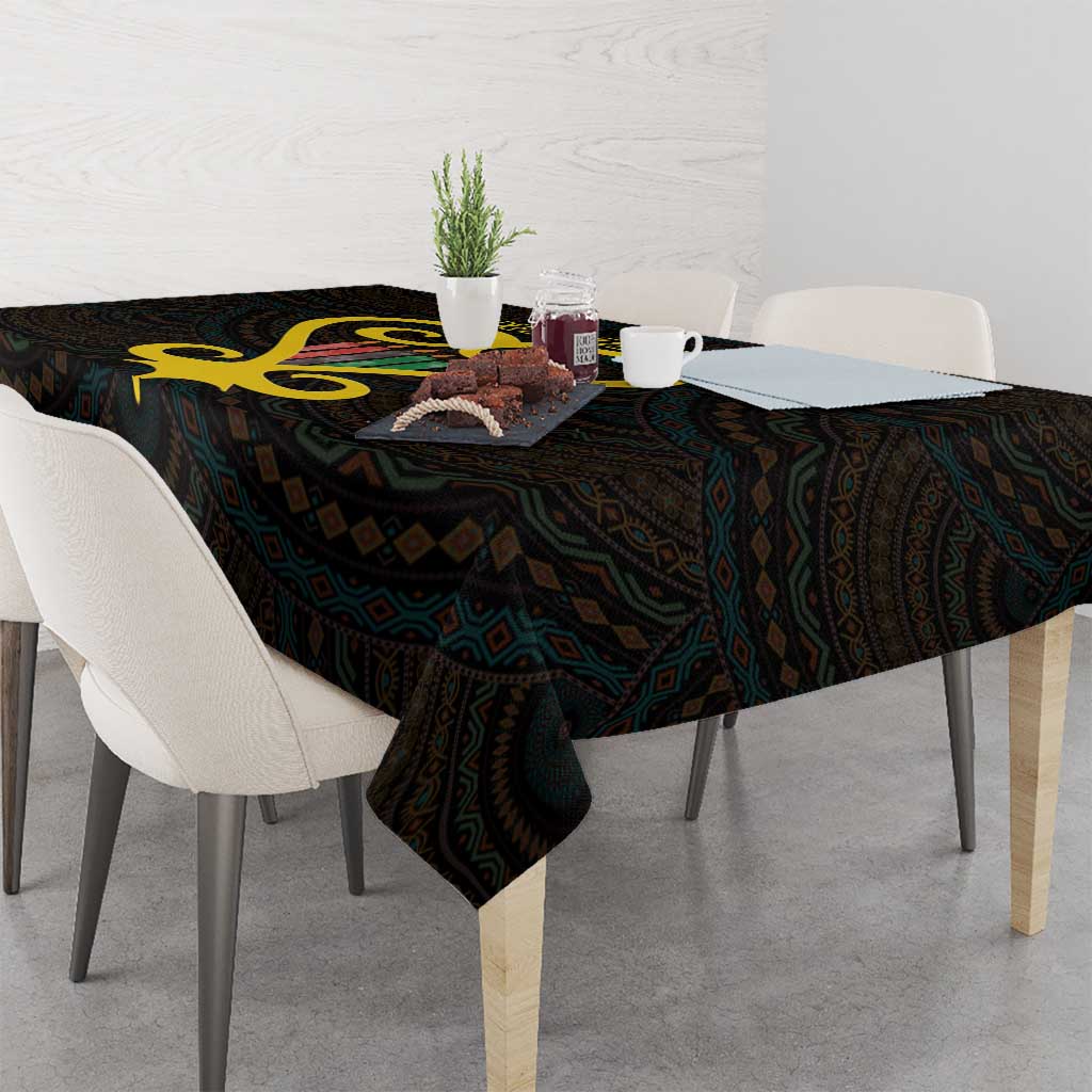 Black tablecloth with gold heart and dark geometric Adinkra-style pattern, draped corner