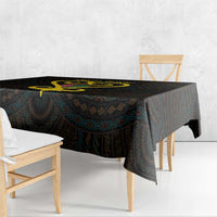 Black tablecloth on rectangular table with gold heart center and geometric pattern border