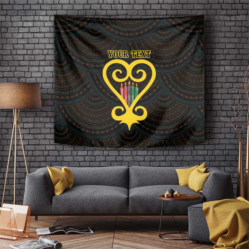 Black wall tapestry with golden heart Adinkra pattern and custom text, hangs over sofa