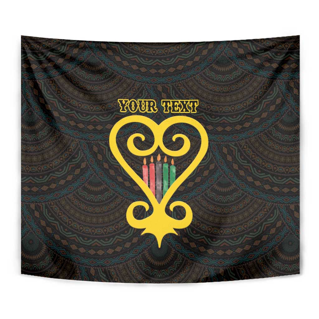 Black tapestry close-up with golden heart Adinkra pattern and custom text, draped backdrop