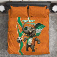 Orange football bedding set with elephant soccer graphic, green-white accents, two pillows