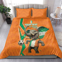 Orange football bedding set with elephant soccer print, green-white accents, duvet and pillows