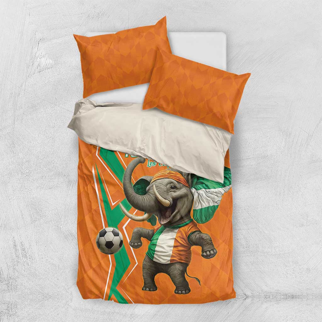 Orange football bedding set with elephant soccer print and two orange pillows