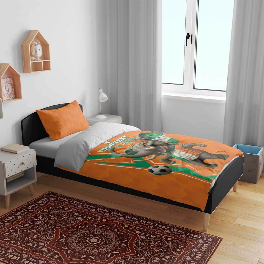 Orange football bedding set with elephant soccer design on fitted duvet and pillows