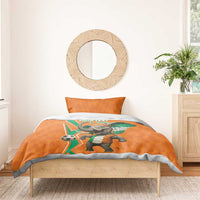 Orange football bedding set with elephant soccer graphic, green-white accents on duvet