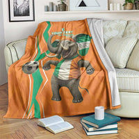 Orange football blanket with elephant mascot in green-white uniform and soccer ball