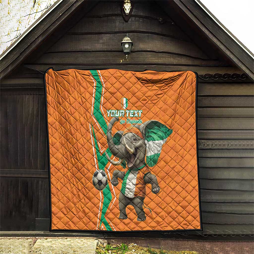 Orange football quilt displayed on wooden wall with elephant mascot soccer print