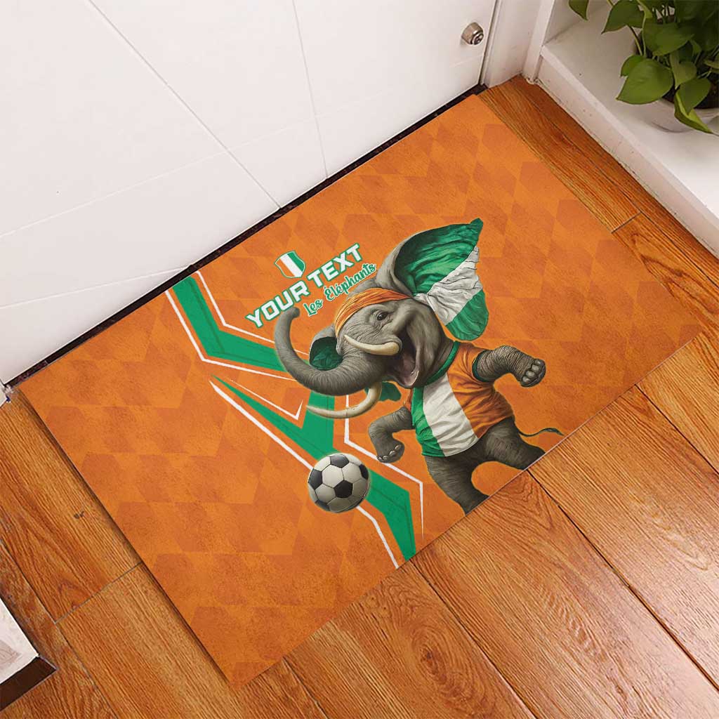 Orange rubber doormat in corner with elephant football graphic and custom text