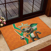 Orange rubber doormat near door with elephant football graphic and custom text