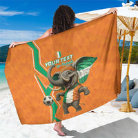 Orange football-themed sarong with elephant mascot and green flag graphic