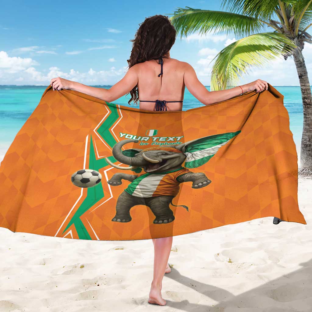 Orange sarong with elephant and soccer ball, geometric pattern, green flag accents