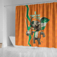 Orange shower curtain with soccer elephant holding a green flag, football graphic