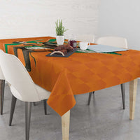 Orange football-themed tablecloth with elephant motif and geometric green border