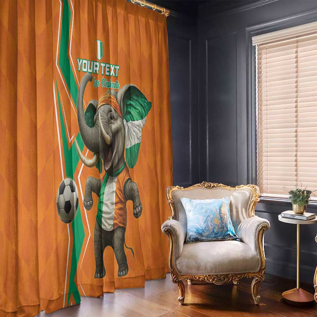 Orange elephant and soccer themed window curtains hanging in front of a room window