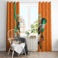 Orange football-themed curtains with elephant artwork and ring top hanging hardware