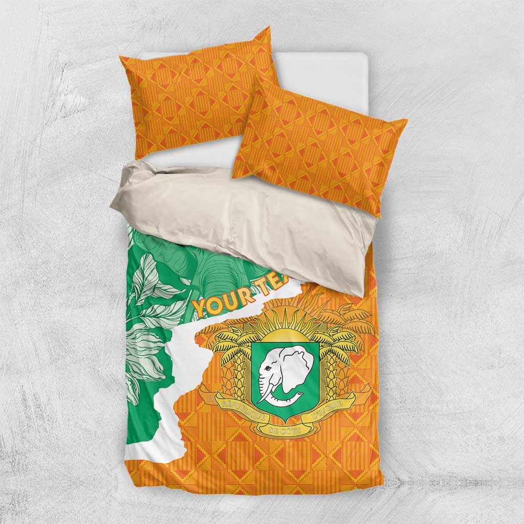 Ivory Coast duvet set with orange and green elephant design and two orange diamond pillows.
