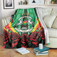 Green personalised blanket with crest emblem, red roses border, and “YOUR TEXT”