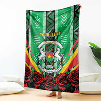 Green throw blanket with central crest, red rose pattern, and “YOUR TEXT” header