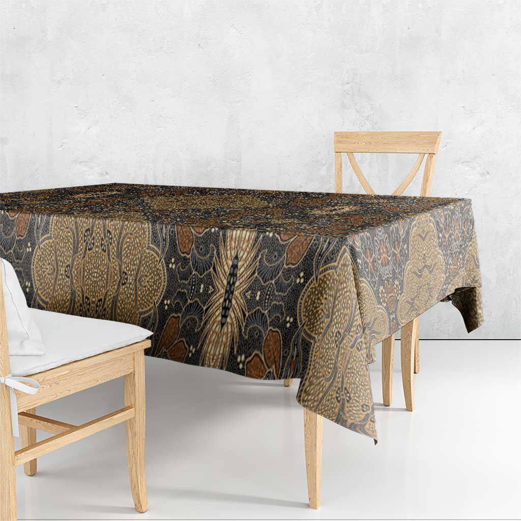 Brown batik tablecloth with gold vine and paisley motifs along the table edge