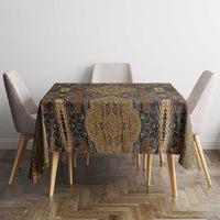 Brown batik tablecloth with ornate gold medallion design on dining table