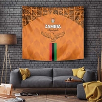 Orange Zambia football tapestry with crest, eagle, and Zambian flag stripe graphic.