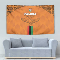 Orange Zambia football tapestry showing eagle emblem, crest, and multicolor vertical stripe.