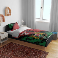 Red, green and black duvet with coat of arms shield and lions graphic, complete set.