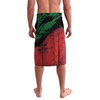 Green and red lavalava sarong with black abstract stripes and diagonal panel