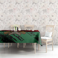 Red and green Kenya-themed tablecloth on dining table with chairs