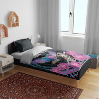 Purple and black duvet set on bed with bird, pink orchids and tribal shield graphic