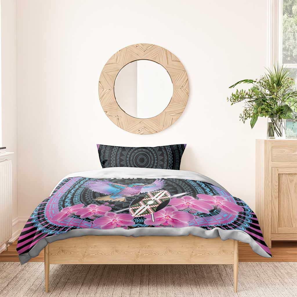 Purple and black bed set with bird and pink orchid print, matching round-pattern pillow