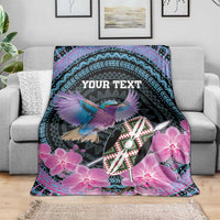 Personalized roller blanket on sofa, purple orchids and bird on black with 'YOUR TEXT'